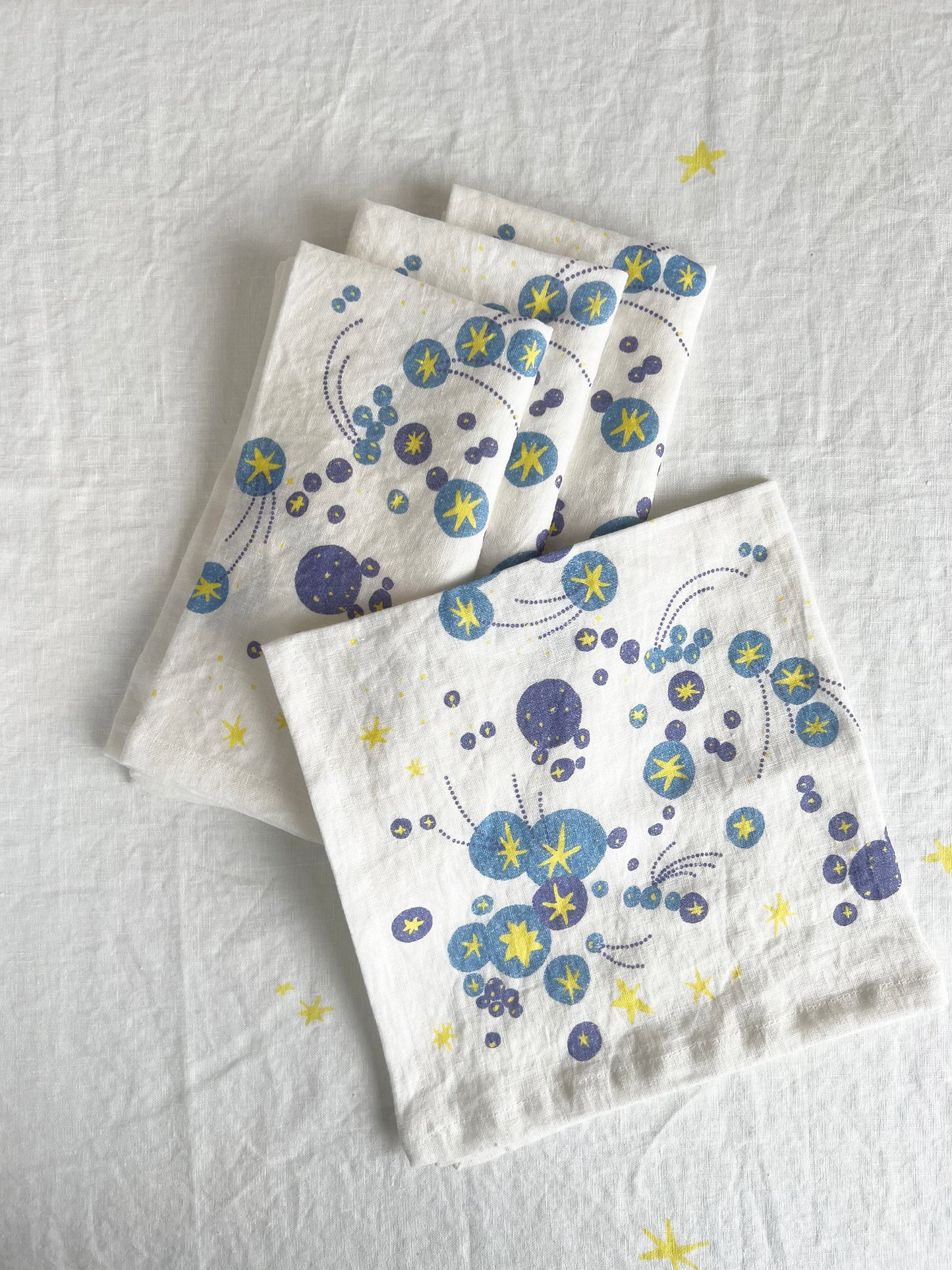 A starburst galaxy and shooting stars waiting to be wished upon. Printed on pure linen, these napkins add a layer of bursting brilliance and joy to any table. A perfect gift to yourself or your host/hostess.