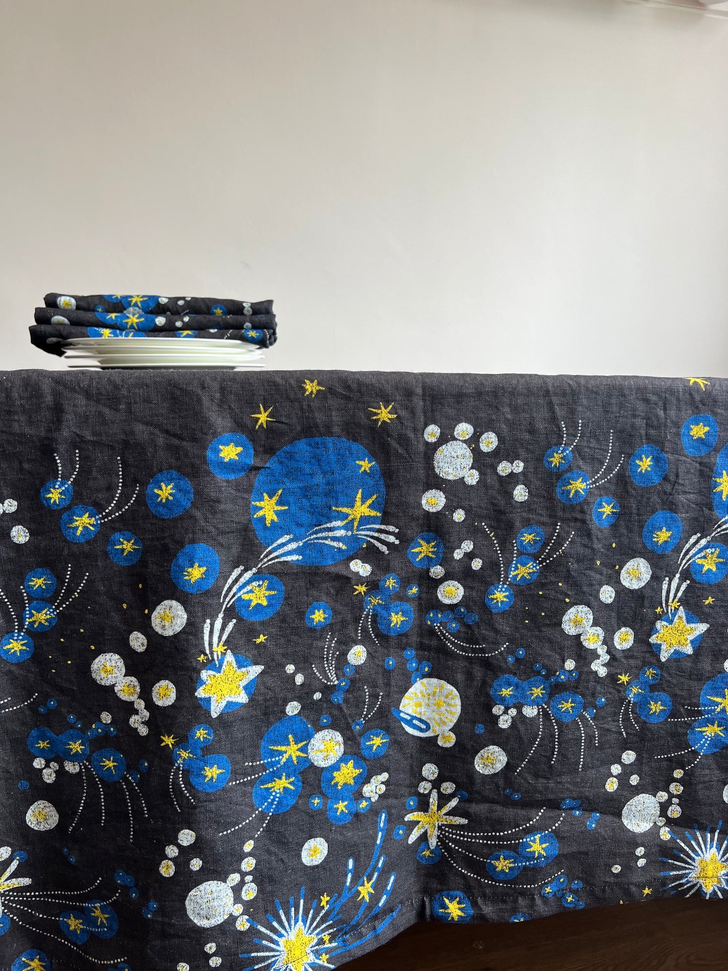 Perhaps one of our most joyful designs, the fun of fireworks mixed with the brilliance of bursting stars behind the stillness of a dark blue sky, our Solaris tablecloth encapsulates celebration at its best. 100% Linen