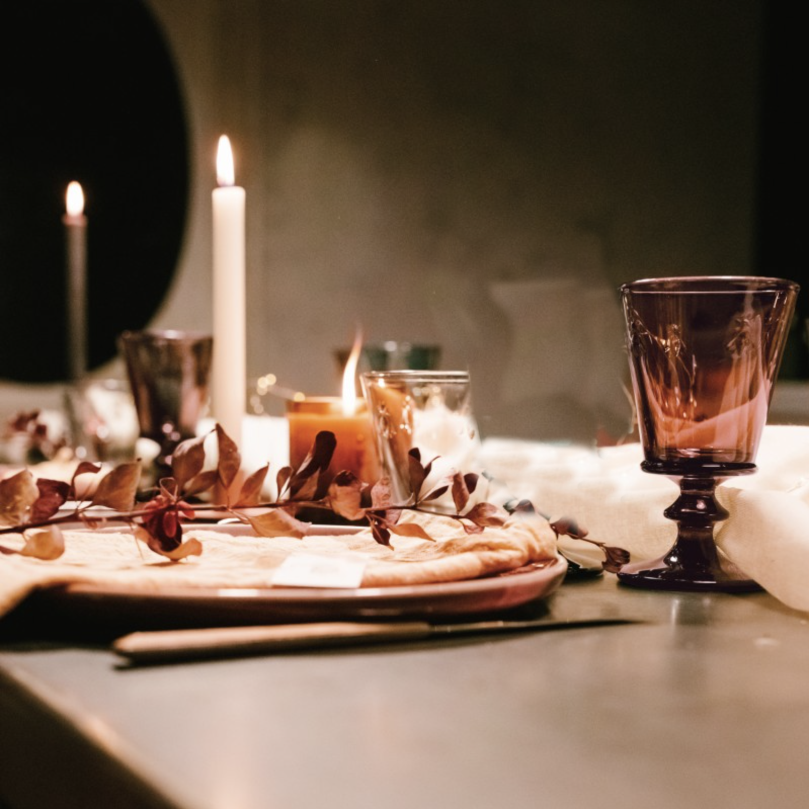 Simple tablescape with bee wine glasses and candles