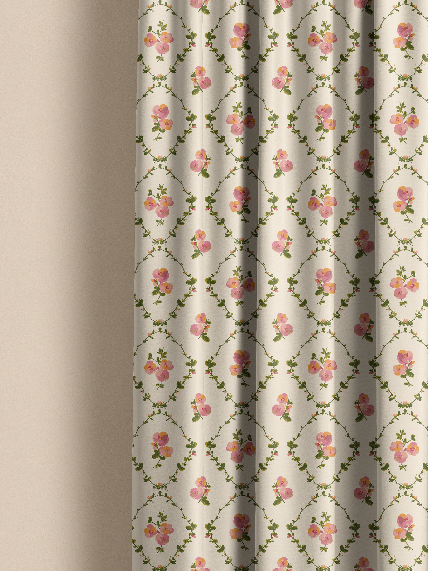 A close-up of a curtain panel with a repeating floral pattern on a warm off-white background, featuring pink roses and green vines. The curtain is shown hanging with soft folds against a neutral beige wall.