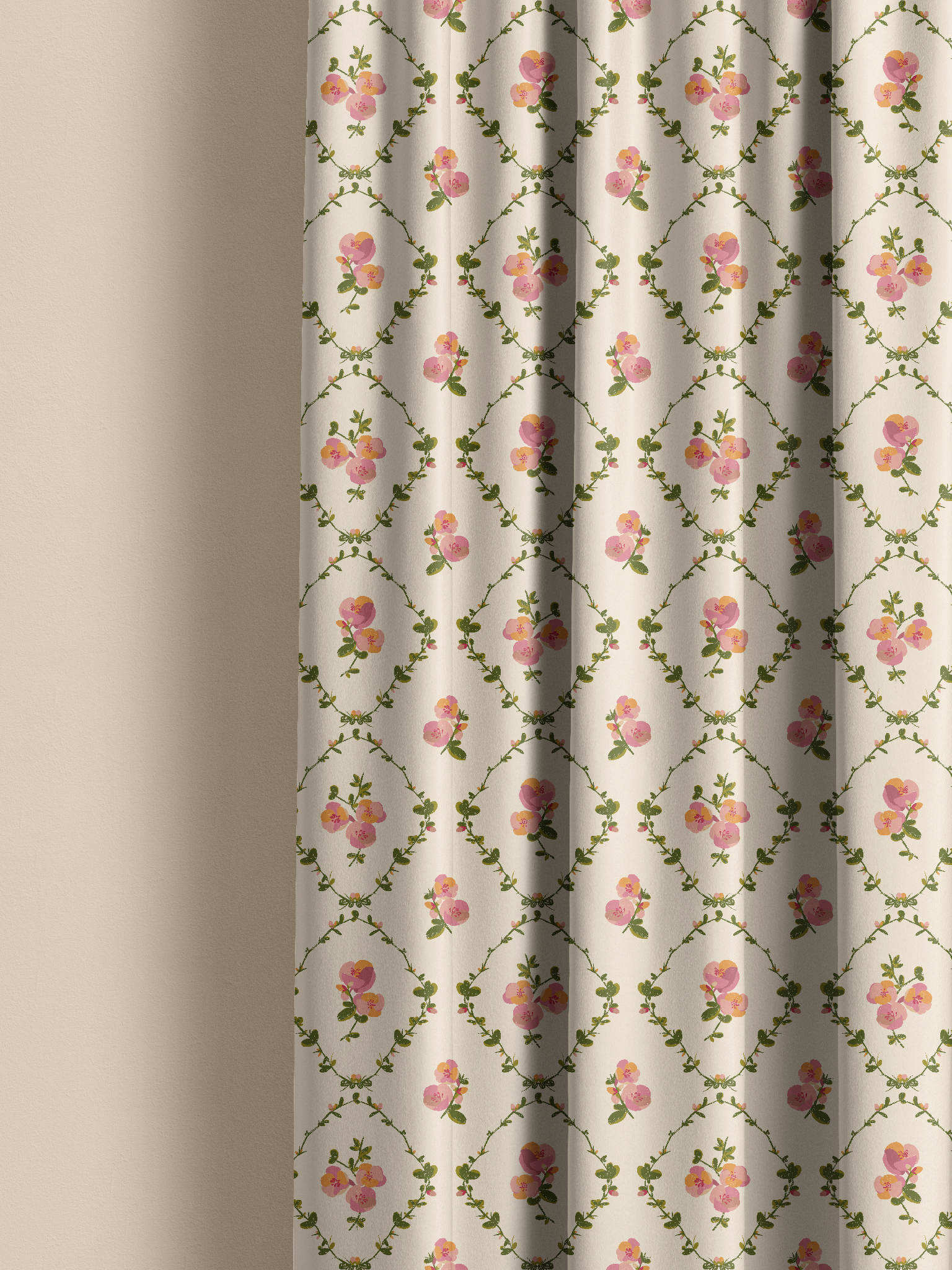A close-up of a curtain panel with a repeating floral pattern on a warm off-white background, featuring pink roses and green vines. The curtain is shown hanging with soft folds against a neutral beige wall.