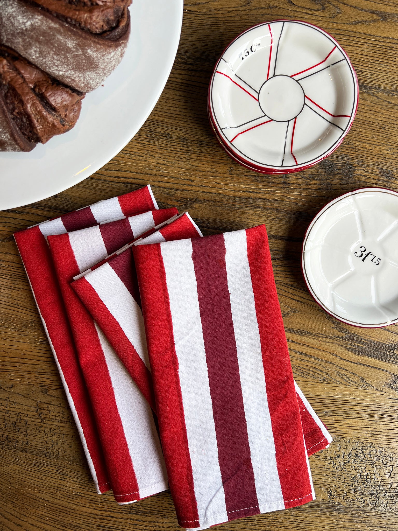 Red striped napkins and chocolate cake on dining table