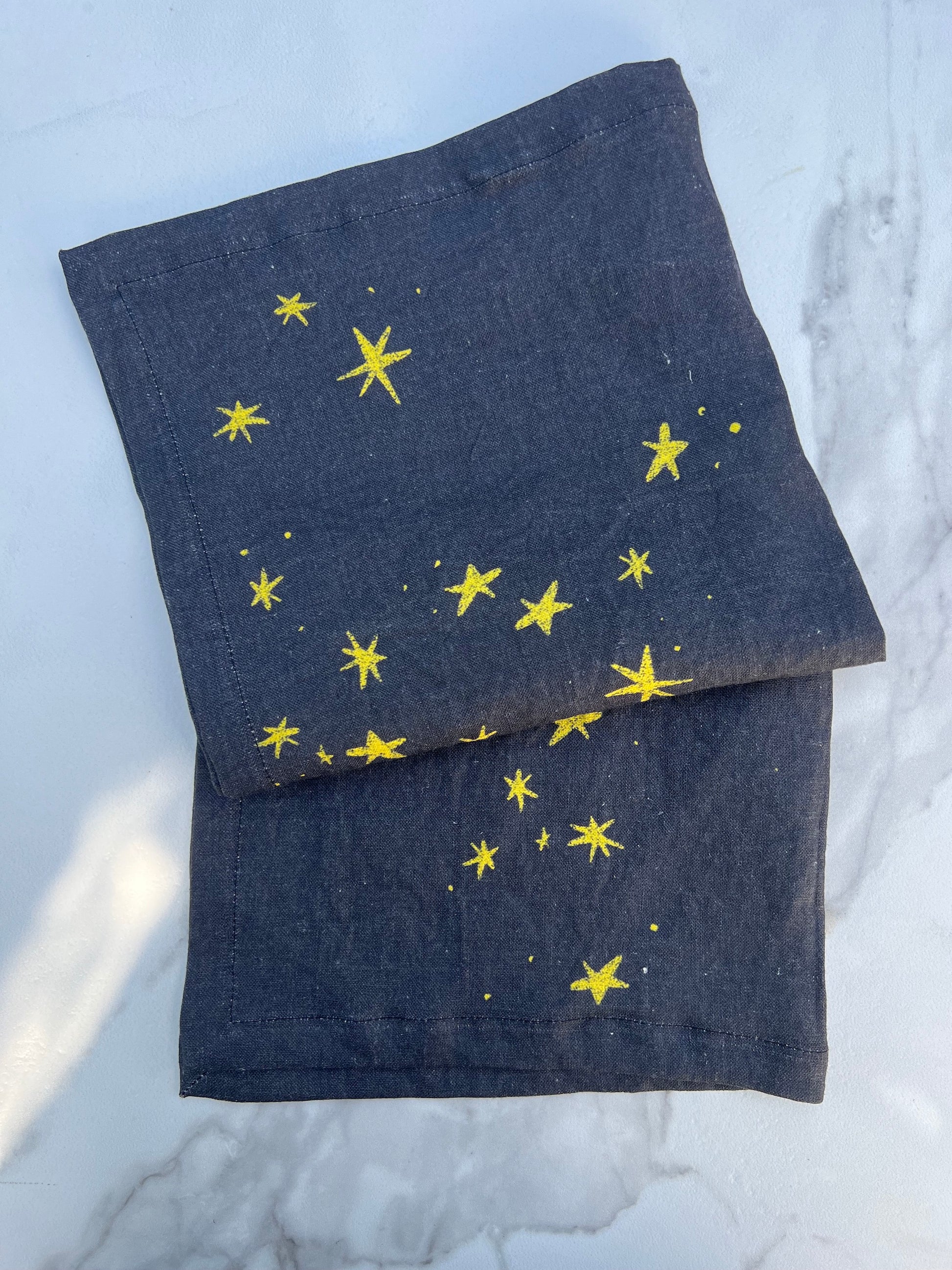 The simple and quiet joy of shining stars against the dark blue night sky.  Printed on pure linen, these napkins add a simple layer of radiance, and unequivocal joy to any table.  A perfect gift to yourself or your host/hostess.